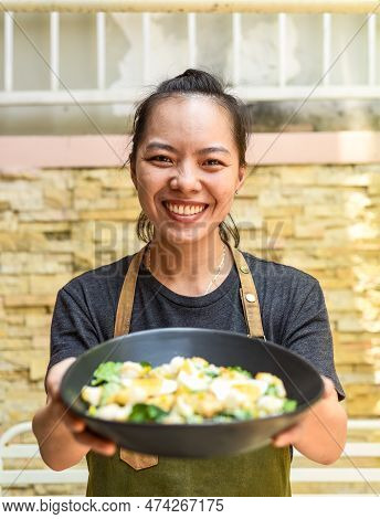 Vietnamese Happy Waitress Holging The Caesar Salad