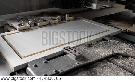Woodworking Industry Concept. Processing Panels On A Woodworking Machine. Processing Panels On A Woo