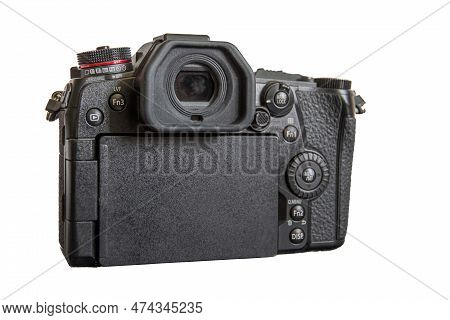 Japanese Professional Mirrorless Digital Camera In Micro Four Thirds Format. Back View. Isolated On 