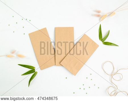 Craft Bags For Packaging Tea, Coffee, Sweets. Top View. Place For Text And Logo. Nateral Background.