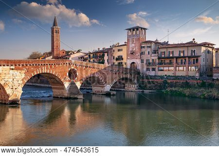 Verona, Italy. Cityscape Image Of Beautiful Italian Town Verona With The Stone Bridge Over Adige Riv