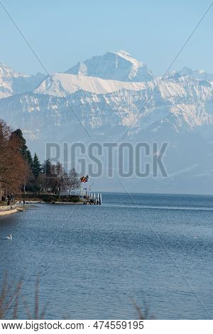 Thun, Switzerland, February 12, 2023 Fantastic View Over The Snow Covered Alps From The Schadau Park