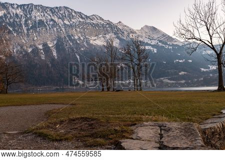 Unterseen, Canton Bern, Switzerland, February 12, 2023 Mountain Scenery At The Lake Of Thun In The L