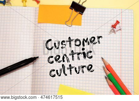 Text Customer Centricity On White Paper On Clipboard With Chart And Calculator
