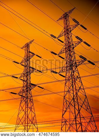 High Voltage Pole On Sunset Background,power Line Tower Electric Transmission Energy Station,plant S