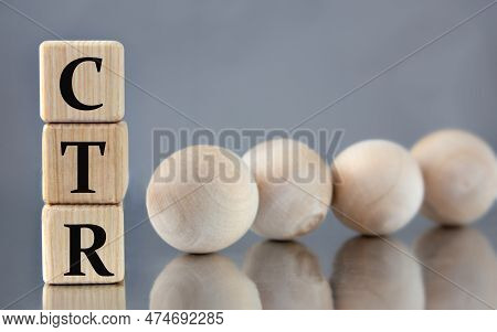 Ctr {clickthrough Rate) - Acronym On Wooden Cubes On The Background Of Light Balls. Investment Conce