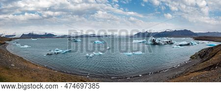 Jokulsarlon Glacial Lake, Lagoon With Ice Blocks, Iceland. Situated Near The Edge Of The Atlantic Oc