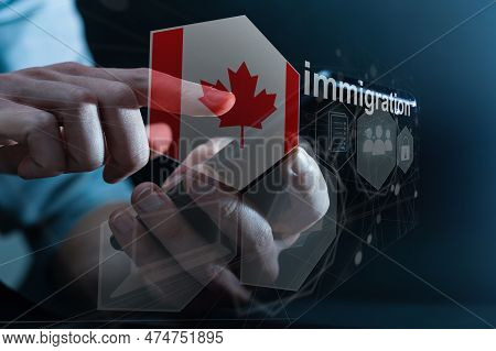 Concept Of Immigration To Canada With Virtual Button Pressing