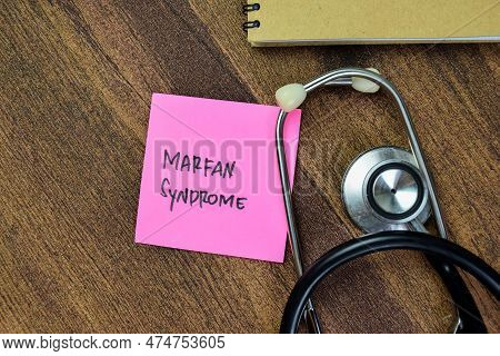 Concept Of Marfan Syndrome Write On Sticky Notes With Stethoscope Isolated On Wooden Table.