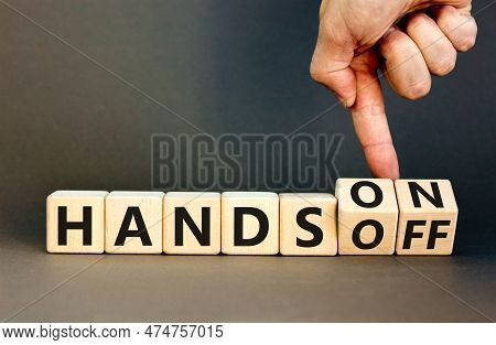Hands On Or Off Symbol. Concept Words Hands On Hands Off On Wooden Cubes. Businessman Hand. Beautifu