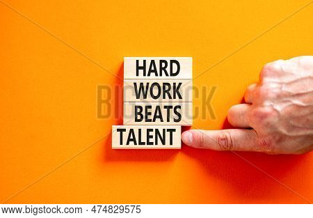 Hard Work Beats Talent Symbol. Concept Words Hard Work Beats Talent On Wooden Block. Beautiful Orang
