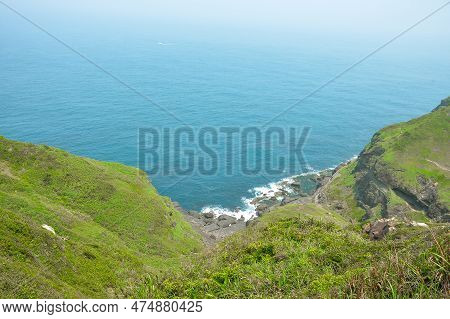 Natural Green Mountain Over The Rocky Sea Shore Beach With Blue Sea Water Of Bitou Cape (bitoujiao) 