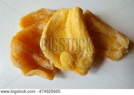 Closeup Of Three Pieces Of Fleshy Yellow Dried Jack Fruit