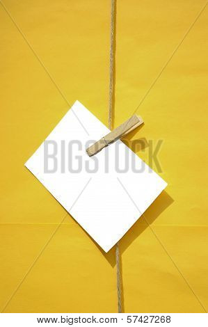 White Blank Reminder Note On Yellow Background