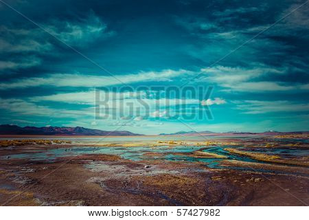 Desert And Mountain Over Blue Sky And White Clouds On Altiplano,bolivia