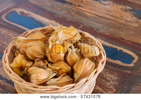 Physalis In Basket On Wooden Table