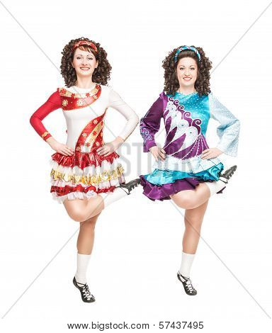 Two Young Women In Irish Dance Dress Dancing Isolated