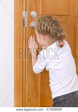 Little Girl Opening Door To Someone.
