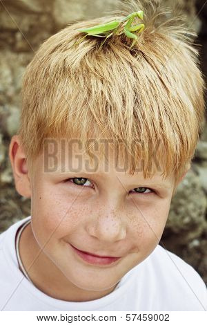 A Boy With Mantis On His Head