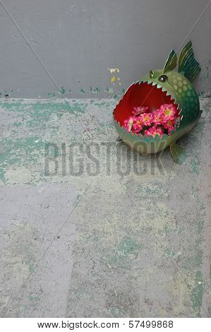 Flowers In A Fish's Mouth Vase