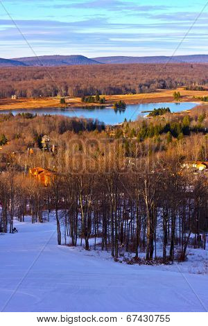 Picturesque wintry valley and lake.