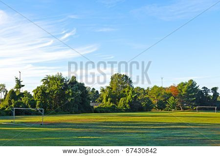 Empty soccer field with goalposts.
