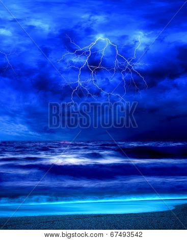 Lightning flashes across the beach from a powerful storm