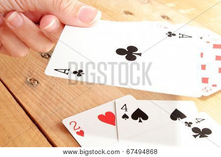 Many poker cards on a wood table