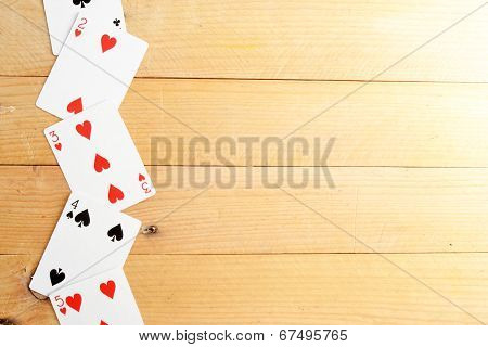 Many poker cards on a wood table