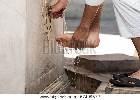 Muslim Washing Feet Before Entering Mosque