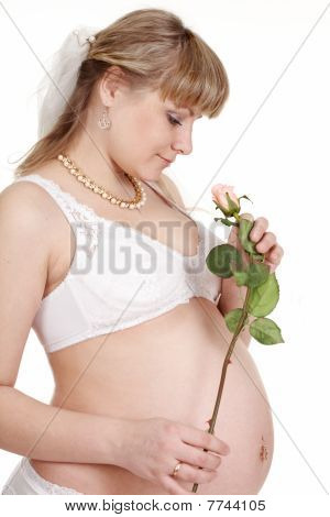těhotná žena s květinou.