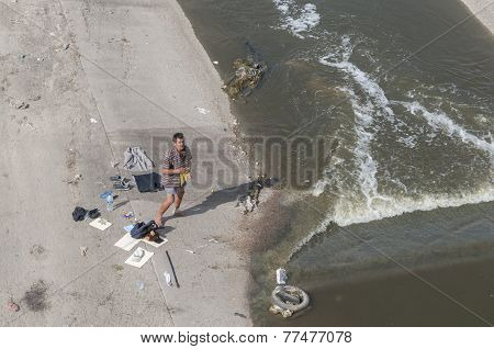 Homeless Man Washes In River
