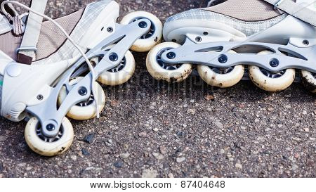 Closeup Roller Skates On Asphalt.