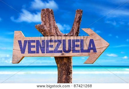Venezuela wooden sign with beach background