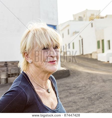 Happy Attractive Senior Woman In Landscape