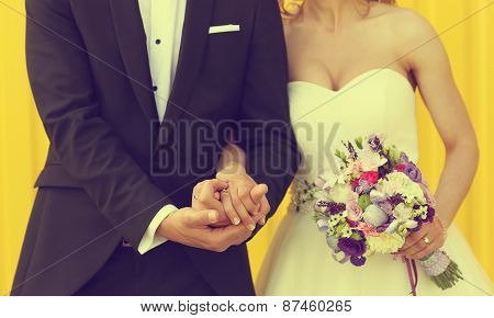 Bride And Groom On A Yellow Background