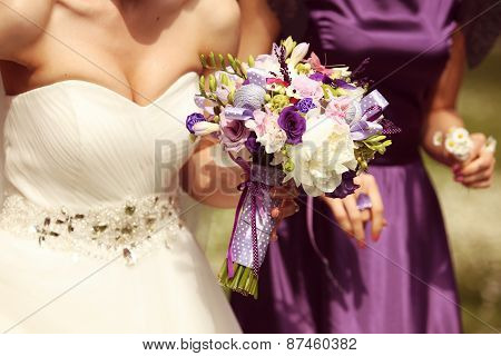 Bride holding flower bouquet