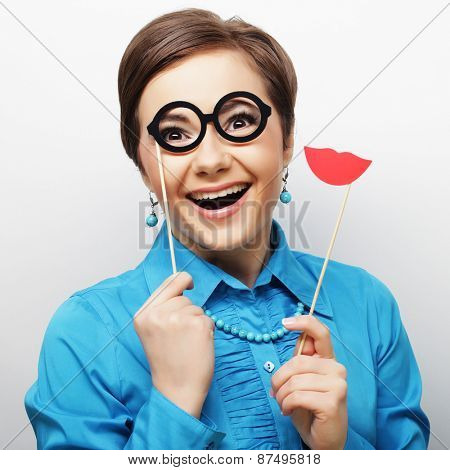 Attractive playful young woman ready for party - falce lips and glasses   
