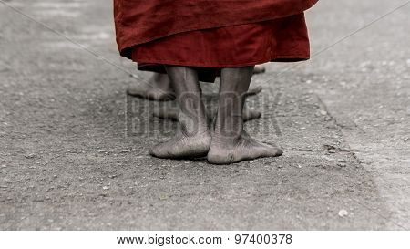 Foots Of Ascetic Buddhist Monk Walking At The Way To  Kyaikhtiyo.