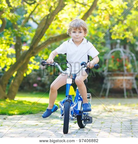 Little Preschool Kid Boy Riding With Bicycle In Summer