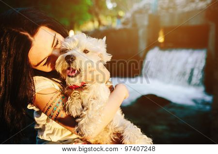 girl playing with a dog