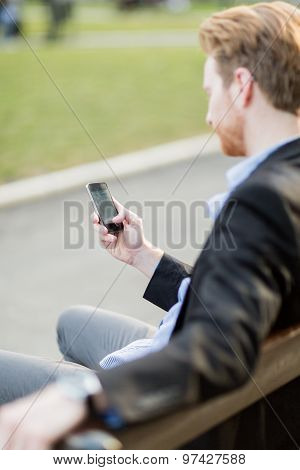 Businessman Holding Phone