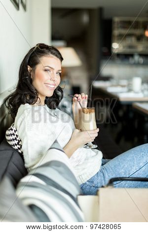 Gorgeous Lady Sipping Coffee In A Bar In A Leisurly Posture