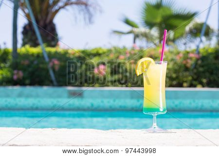 Glass Of Happy Days Cocktail Near The Pool