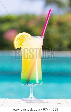 Glass Of Happy Days Cocktail Near The Pool