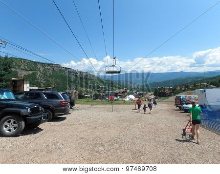 People Walk Along Path During Wanderlust Festival At Snowmass Village