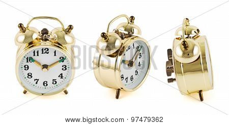 Golden mechanical alarm clock isolated
