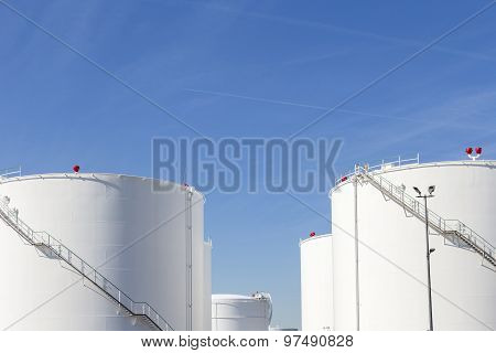 White Tanks In Tank Farm With Iron Staircase