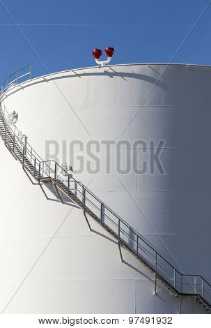White Tanks In Tank Farm With Iron Staircase