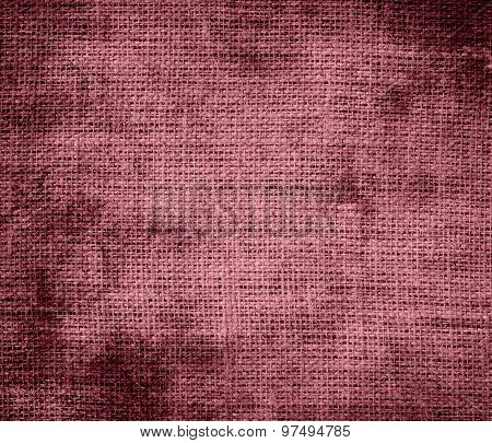 Grunge background of deep puce burlap texture